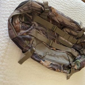 Cabela’s medium size camouflage duffle bag